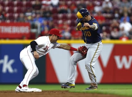 Sep 24, 2022; Cincinnati, Ohio, USA; Milwaukee Brewers catcher Omar Narvaez (10) is tagged out by Cincinnati Reds second baseman Alejo Lopez (35) during the third inning at Great American Ball Park. Mandatory Credit: David Kohl-USA TODAY Sports