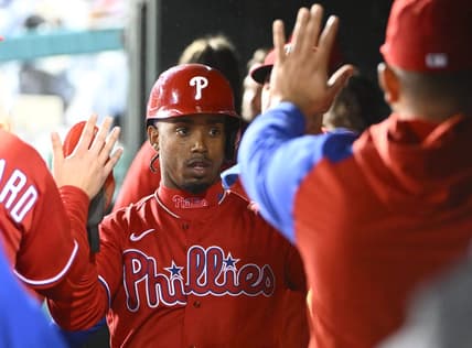 Oct 1, 2022; Washington, District of Columbia, US;  Philadelphia Phillies second baseman Jean Segura (2) is congratulated by teammates after scoring a run during the second inning against the Washington Nationals at Nationals Park. Mandatory Credit: Brad Mills-USA TODAY Sports