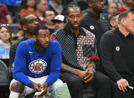 Oct 30, 2022; Los Angeles, California, USA;  Los Angeles Clippers forward Kawhi Leonard (2) sits next to guard John Wall (11) on from the bench in the first half at Crypto.com Arena. Mandatory Credit: Jayne Kamin-Oncea-USA TODAY Sports