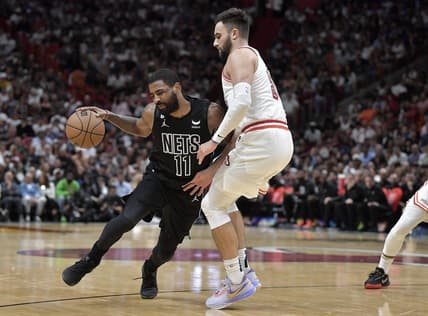 Jan 8, 2023; Miami, Florida, USA;  Brooklyn Nets guard Kyrie Irving (11) bumps into Miami Heat guard Max Strus (31) during the fourth quarter at FTX Arena. Mandatory Credit: Michael Laughlin-USA TODAY Sports