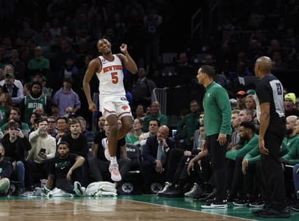 Mar 5, 2023; Boston, Massachusetts, USA; New York Knicks guard Immanuel Quickley (5) celebrates after a basket in front of the Boston Celtics bench during the overtime period at TD Garden. Mandatory Credit: Winslow Townson-USA TODAY Sports