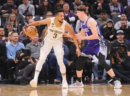Mar 6, 2023; Sacramento, California, USA; New Orleans Pelicans shooting guard CJ McCollum (3) controls the ball against Sacramento Kings shooting guard Kevin Huerter (9) during the first quarter at Golden 1 Center. Mandatory Credit: Kelley L Cox-USA TODAY Sports