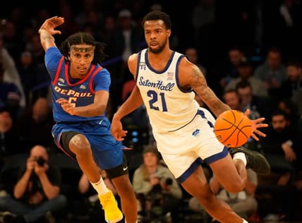 Mar 8, 2023; New York, NY, USA;  Seton Hall Pirates guard Femi Odukale (21) controls the ball as DePaul Blue Demons guard Philmon Gebrewhit (5) defends during the first half at Madison Square Garden. Mandatory Credit: Robert Deutsch-USA TODAY Sports