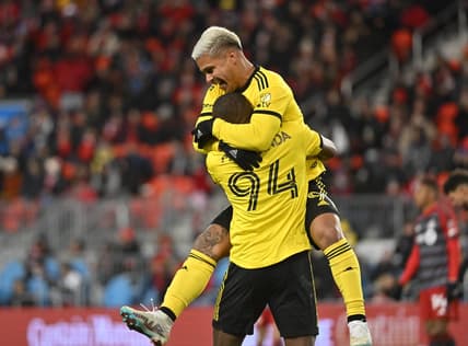 Mar 11, 2023; Toronto, Ontario, CAN; Columbus Crew forward Cucho Hernandez (9) celebrates with Columbus Crew midfielder Jimmy Medranda (94) after a goal against the Toronto FC in a MLS game at BMO Field. Mandatory Credit: Dan Hamilton-USA TODAY Sports