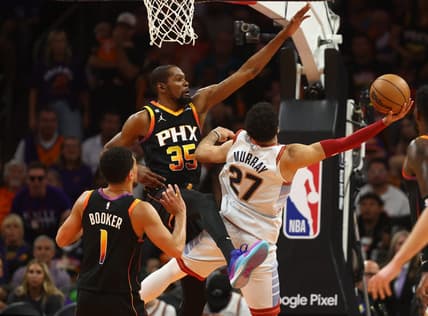 May 5, 2023; Phoenix, Arizona, USA; Phoenix Suns forward Kevin Durant (35) defends against Denver Nuggets guard Jamal Murray (27) in the first half during game three of the 2023 NBA playoffs at Footprint Center. Mandatory Credit: Mark J. Rebilas-USA TODAY Sports