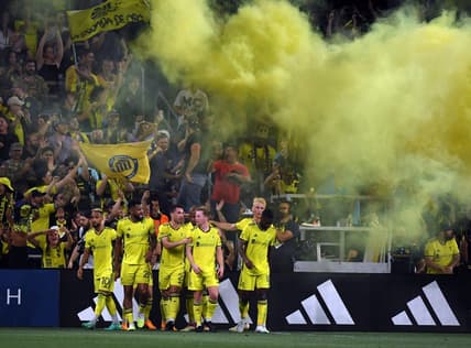 May 6, 2023; Nashville, Tennessee, USA; Nashville SC players celebrate after a goal by midfielder Hany Mukhtar (10) during the first half against the Chicago Fire at Geodis Park. Mandatory Credit: Christopher Hanewinckel-USA TODAY Sports