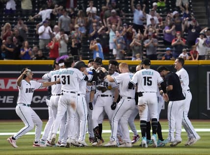 Jun 1, 2023; Phoenix, Arizona, USA; Arizona Diamondbacks left fielder Corbin Carroll (7) celebrates his walk off two RBI single against the Colorado Rockies during the ninth inning at Chase Field. Mandatory Credit: Joe Camporeale-USA TODAY Sports