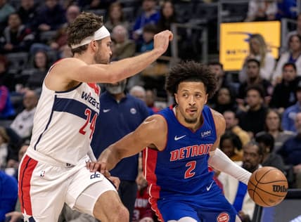 Nov 27, 2023; Detroit, Michigan, USA; Washington Wizards forward Corey Kispert (24) defends against Detroit Pistons guard Cade Cunningham (2) during the in the first half at Little Caesars Arena. Mandatory Credit: David Reginek-USA TODAY Sports