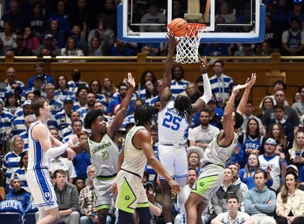 Dec 30, 2023; Durham, North Carolina, USA; Duke Blue Devils forward Mark Mitchell (25) shoots during the first half against the Queens Royals at Cameron Indoor Stadium. Mandatory Credit: Rob Kinnan-USA TODAY Sports