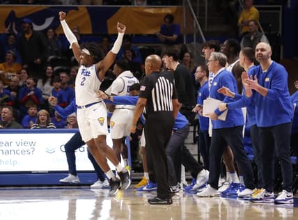 Jan 31, 2024; Pittsburgh, Pennsylvania, USA; Pittsburgh Panthers forward Blake Hinson (2) celebrates a three point basket in front of the PITT bench against the Wake Forest Demon Deacons during the second half at the Petersen Events Center. Pittsburgh won 77-72. Mandatory Credit: Charles LeClaire-USA TODAY Sports