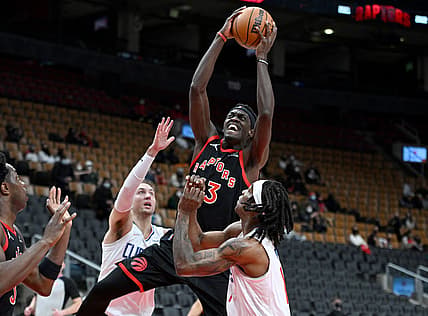 Dec 31, 2021; Toronto, Ontario, CAN;   Toronto Raptors forward Pascal Siakam (43) shoots the ball over Los Angeles Clippers guard Luke Kennard (5) and guard Terance Mann (14) in the first half at Scotiabank Arena. Mandatory Credit: Dan Hamilton-USA TODAY Sports