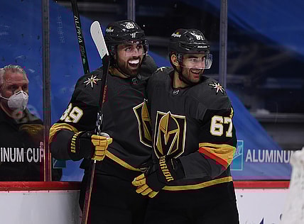 Mar 27, 2021; Denver, Colorado, USA;Vegas Golden Knights left wing Max Pacioretty (67) and Vegas Golden Knights right wing Alex Tuch (89) celebrate an overtime period win over the Colorado Avalanche at Ball Arena. Mandatory Credit: Ron Chenoy-USA TODAY Sports