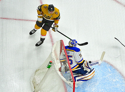 May 8, 2021; Las Vegas, Nevada, USA; St. Louis Blues goaltender Ville Husso (35) makes a first period save against Vegas Golden Knights right wing Reilly Smith (19) at T-Mobile Arena. Mandatory Credit: Stephen R. Sylvanie-USA TODAY Sports
