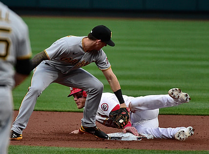 May 19, 2021; St. Louis, Missouri, USA;  St. Louis Cardinals center fielder Harrison Bader (48) steals second base as he slides safely past Pittsburgh Pirates shortstop Kevin Newman (27) during the second inning at Busch Stadium. Mandatory Credit: Jeff Curry-USA TODAY Sports