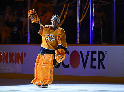 May 21, 2021; Nashville, Tennessee, USA; Nashville Predators goaltender Juuse Saros (74) waives to the crowd after being named the third star of the game after a double overtime win against the Carolina Hurricanes in game three of the first round of the 2021 Stanley Cup Playoffs at Bridgestone Arena. Mandatory Credit: Christopher Hanewinckel-USA TODAY Sports