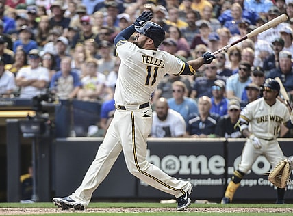 Aug 4, 2021; Milwaukee, Wisconsin, USA; Milwaukee Brewers first baseman Rowdy Tellez (11) hits a three-run home run in the seventh inning against the Pittsburgh Pirates at American Family Field. Mandatory Credit: Benny Sieu-USA TODAY Sports