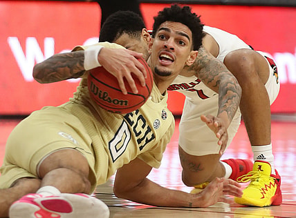 Georgia Tech's Michael Devoe looks for an outlet as he battles for a loose ball against Louisville's Carlik Jones in the second half at the KFC Yum! Center on Monday, February 1, 2021, in Louisville, Kentucky.  Louisville won 74-58.

Louisvillegatech17