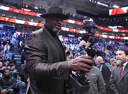 Feb 18, 2023; Salt Lake City, UT, USA; Shaquille O'Neal films himself with a camera during the 2023 All Star Saturday Night at Vivint Arena. Mandatory Credit: Kyle Terada-USA TODAY Sports