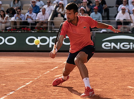 Jun 9 2023; Paris,France; Novak Djokovic (SRB) returns a shot during his semifinal match against Carlos Alcaraz (ESP) on day 13 at Stade Roland-Garros. Mandatory Credit: Susan Mullane-USA TODAY Sports