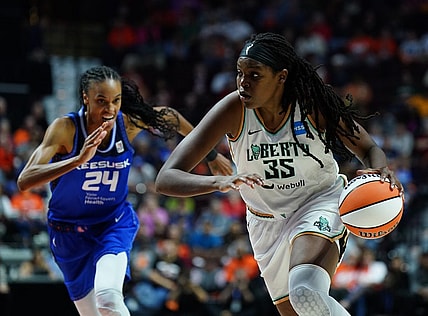 Oct 1, 2023; Uncasville, Connecticut, USA; New York Liberty forward Jonquel Jones (35) drives the ball against Connecticut Sun forward DeWanna Bonner (24) in the first half during game four of the 2023 WNBA Playoffs at Mohegan Sun Arena. Mandatory Credit: David Butler II-USA TODAY Sports