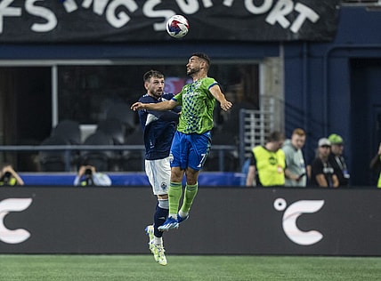 Oct 7, 2023; Seattle, Washington, USA; Seattle Sounders midfielder Cristian Roldan (7) and Vancouver Whitecaps defender Tristan Blackmon (6) go up for a header during the first half at Lumen Field. Mandatory Credit: Stephen Brashear-USA TODAY Sports