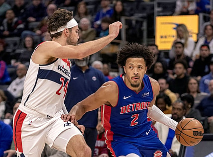 Nov 27, 2023; Detroit, Michigan, USA; Washington Wizards forward Corey Kispert (24) defends against Detroit Pistons guard Cade Cunningham (2) during the in the first half at Little Caesars Arena. Mandatory Credit: David Reginek-USA TODAY Sports