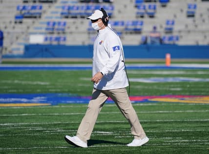 Oct 31, 2020; Lawrence, Kansas, USA; Kansas Jayhawks head coach Les Miles leaves the field after checking on an injury during the game against the Iowa State Cyclones at David Booth Kansas Memorial Stadium. Mandatory Credit: Denny Medley-USA TODAY Sports