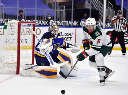 May 13, 2021; St. Louis, Missouri, USA;  St. Louis Blues goaltender Jordan Binnington (50) defends the net against Minnesota Wild left wing Zach Parise (11) during the third period at Enterprise Center. Mandatory Credit: Jeff Curry-USA TODAY Sports