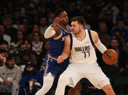 Jan 12, 2022; New York, New York, USA; Dallas Mavericks guard Luka Doncic (77) dribbles the ball against New York Knicks guard RJ Barrett (9) during the second half at Madison Square Garden. Mandatory Credit: Andy Marlin-USA TODAY Sports