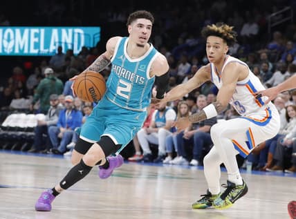Mar 14, 2022; Oklahoma City, Oklahoma, USA; Charlotte Hornets guard LaMelo Ball (2) dribbles the ball against Oklahoma City Thunder guard Tre Mann (23) during the first quarter at Paycom Center. Mandatory Credit: Alonzo Adams-USA TODAY Sports