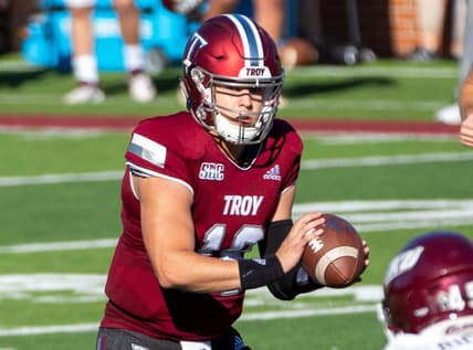 Troy University quarterback Gunnar Watson (18) grasps the ball after the snap.

Troy Vs Eastern Kentucky