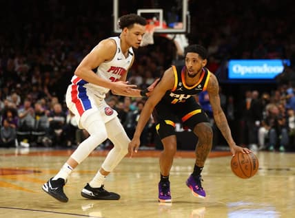 Nov 25, 2022; Phoenix, Arizona, USA; Phoenix Suns guard Cameron Payne (15) moves the ball against Detroit Pistons forward Kevin Knox II in the first half at Footprint Center. Mandatory Credit: Mark J. Rebilas-USA TODAY Sports