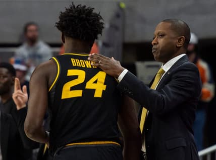 Missouri Tigers head coach Dennis Gates greets Missouri Tigers guard Kobe Brown (24) on the sideline as Auburn Tigers take on Missouri Tigers at Neville Arena in Auburn, Ala., on Tuesday, Feb. 14, 2023. Auburn Tigers lead Missouri Tigers 45-18 at halftime.