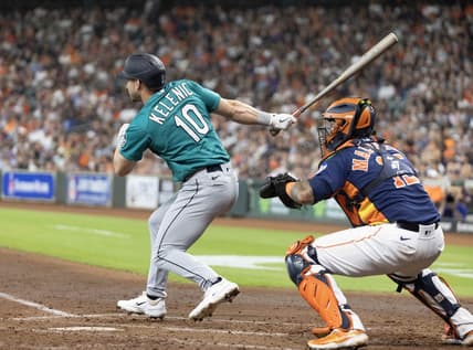 Jul 9, 2023; Houston, Texas, USA; Seattle Mariners left fielder Jarred Kelenic (10) hits a RBI double against the Houston Astros in the fourth inning at Minute Maid Park. Mandatory Credit: Thomas Shea-USA TODAY Sports
