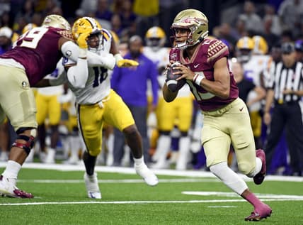Sep 4, 2022; New Orleans, Louisiana, USA; Florida State Seminoles quarterback Jordan Travis (13) scrambles during the first half against the Louisiana State Tigers at Caesars Superdome. Mandatory Credit: Melina Myers-USA TODAY Sports