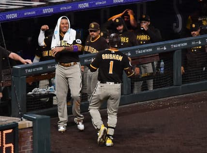 Jul 31, 2023; Denver, Colorado, USA; San Diego Padres third baseman Manny Machado (13) comes out of the dugout to greet center fielder Trent Grisham (1) after hitting a home run in the ninth inning to tie the game against the Colorado Rockies at Coors Field. Mandatory Credit: John Leyba-USA TODAY Sports