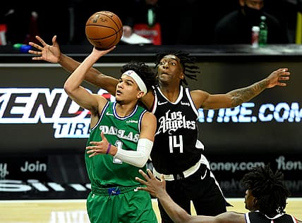 Dec 27, 2020; Los Angeles, California, USA;   Dallas Mavericks guard Tyrell Terry (1) shoots against Los Angeles Clippers guard Terance Mann (14) in the second half at Staples Center. Mandatory Credit: Jayne Kamin-Oncea-USA TODAY Sports