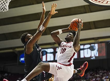 Feb 26, 2022; Tuscaloosa, Alabama, USA; Alabama Crimson Tide center Charles Bediako (10) goes to the basket against South Carolina Gamecocks forward Wildens Leveque (15) during second half at Coleman Coliseum. Mandatory Credit: Marvin Gentry-USA TODAY Sports