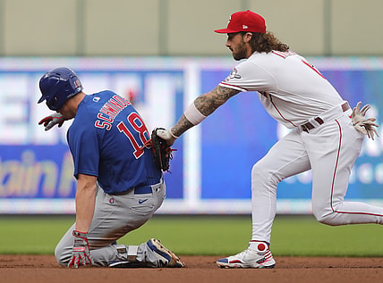 Aug 16, 2021; Cincinnati, Ohio, USA; Chicago Cubs first baseman Frank Schwindel (18) slide into second for a double against Cincinnati Reds second baseman Jonathan India (6) during the first inning at Great American Ball Park. Mandatory Credit: David Kohl-USA TODAY Sports