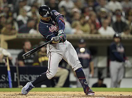 Sep 24, 2021; San Diego, California, USA;  Atlanta Braves left fielder Adam Duvall (14) hits an hits an RBI single against the San Diego Padres during the sixth inning at Petco Park. Mandatory Credit: Ray Acevedo-USA TODAY Sports