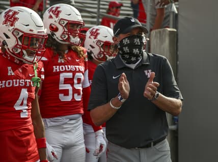 Nov 14, 2020; Houston, Texas, USA; Houston Cougars head coach Dana Holgorsen waits with the team before taking the field against the South Florida Bulls at TDECU Stadium. Mandatory Credit: Troy Taormina-USA TODAY Sports