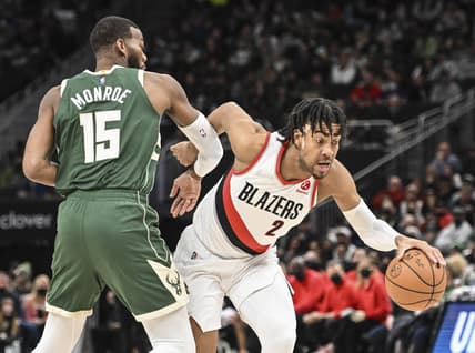 Feb 14, 2022; Milwaukee, Wisconsin, USA; Portland Trail Blazers forward Trendon Watford (2) drives for the basket against Milwaukee Bucks center Greg Monroe (15) in the fourth quarter at Fiserv Forum. Mandatory Credit: Benny Sieu-USA TODAY Sports