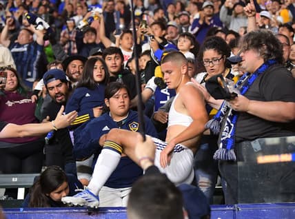 Apr 23, 2022; Carson, California, USA; Los Angeles Galaxy forward Dejan Joveljic (99) tears off his jersey and runs into the stands to celebrate after scoring a goal in the second half against the Nashville SC at Dignity Health Sports Park. Mandatory Credit: Jayne Kamin-Oncea-USA TODAY Sports