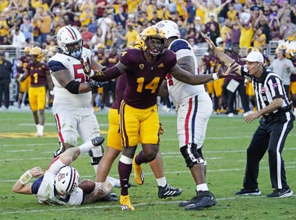 Nov 27, 2021; Tempe, Arizona, USA; Arizona State Sun Devils defensive lineman Stanley Lambert (14) reacts after sacking Arizona Wildcats quarterback Will Plummer (15) during the 95th Territorial Cup game at Sun Devil Stadium. Mandatory Credit: Rob Schumacher-Arizona Republic

Ncaa Football Arizona Wildcats At Arizona State Sun Devils