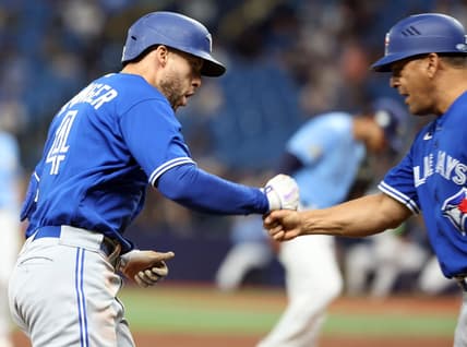 May 23, 2023; St. Petersburg, Florida, USA; Toronto Blue Jays right fielder George Springer (4) celebrates as he runs around the bases after he hits a home run during the third inning against the Tampa Bay Rays at Tropicana Field. Mandatory Credit: Kim Klement-USA TODAY Sports