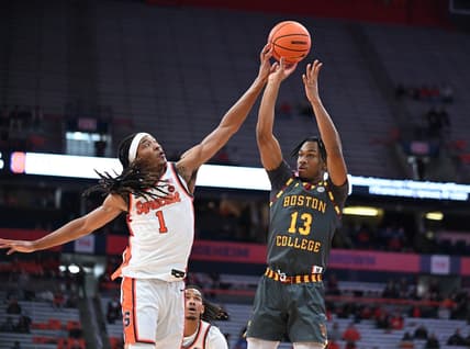 Jan 10, 2024; Syracuse, New York, USA; Syracuse Orange forward Maliq Brown (1) blocks a shot by Boston College Eagles guard Donald Hand Jr. (13) in the first half at the JMA Wireless Dome. Mandatory Credit: Mark Konezny-USA TODAY Sports