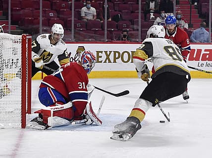 Jun 18, 2021; Montreal, Quebec, CAN; Montreal Canadiens goalie Carey Price (31) stops Vegas Golden Knights forward Jonathan Marchessault (81) and teammate forward Max Pacioretty (67) during the first period in game three of the 2021 Stanley Cup Semifinals at the Bell Centre. Mandatory Credit: Eric Bolte-USA TODAY Sports