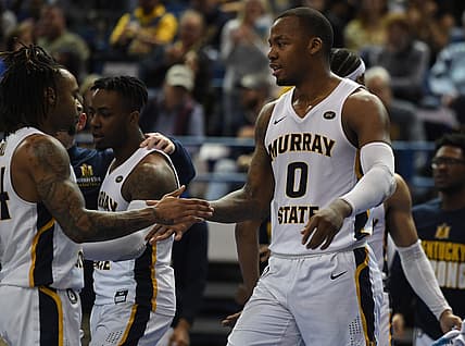 Feb 10, 2022; Nashville, Tennessee, USA; Murray State Racers forward KJ Williams (0) is congratulated by teammates after a basket during the second half against the Tennessee State Tigers at Gentry Complex. Mandatory Credit: Christopher Hanewinckel-USA TODAY Sports