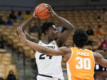 Feb 22, 2022; Columbia, Missouri, USA; Missouri Tigers forward Kobe Brown (24) looks to pass as Tennessee Volunteers guard Josiah-Jordan James (30) defends  during the first half at Mizzou Arena. Mandatory Credit: Denny Medley-USA TODAY Sports