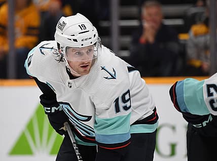 Oct 12, 2023; Nashville, Tennessee, USA; Seattle Kraken left wing Jared McCann (19) waits for a face off during the first period against the Nashville Predators at Bridgestone Arena. Mandatory Credit: Christopher Hanewinckel-USA TODAY Sports